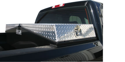 Black truck box with polished aluminum doors by Highway Products.
