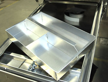 Trays for pickup truck storage toolboxes are built with thicker aluminum than most toolboxes by Highway Products.